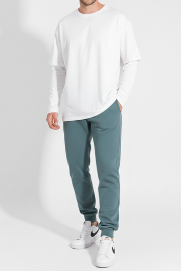 Men’s winter trousers in teal color front view worn by model