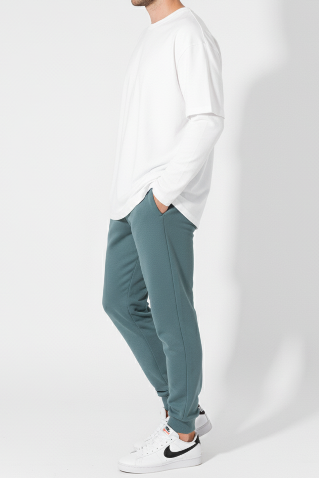 Side view of men’s winter trousers in teal color casual wear