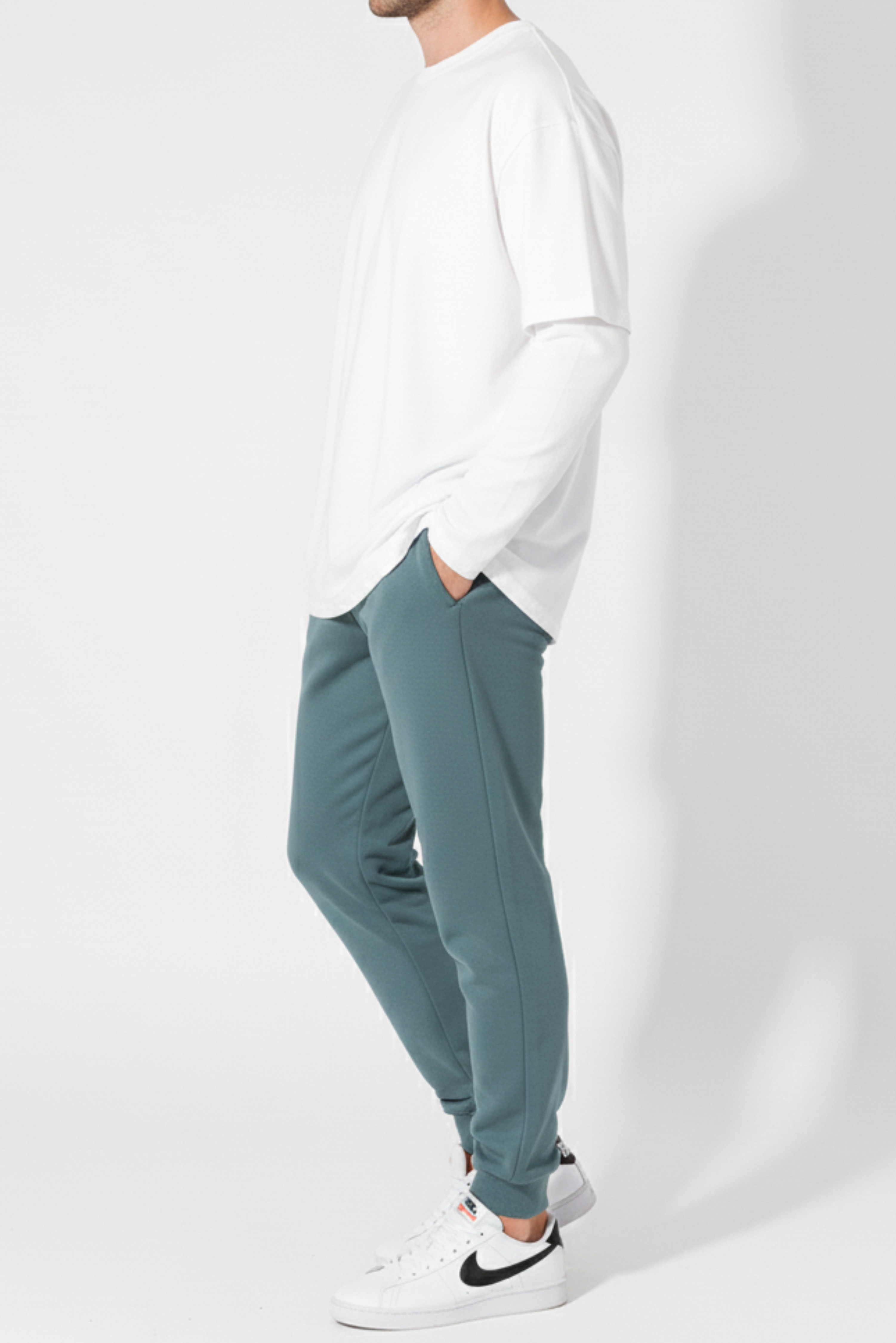 Side view of men’s winter trousers in teal color casual wear