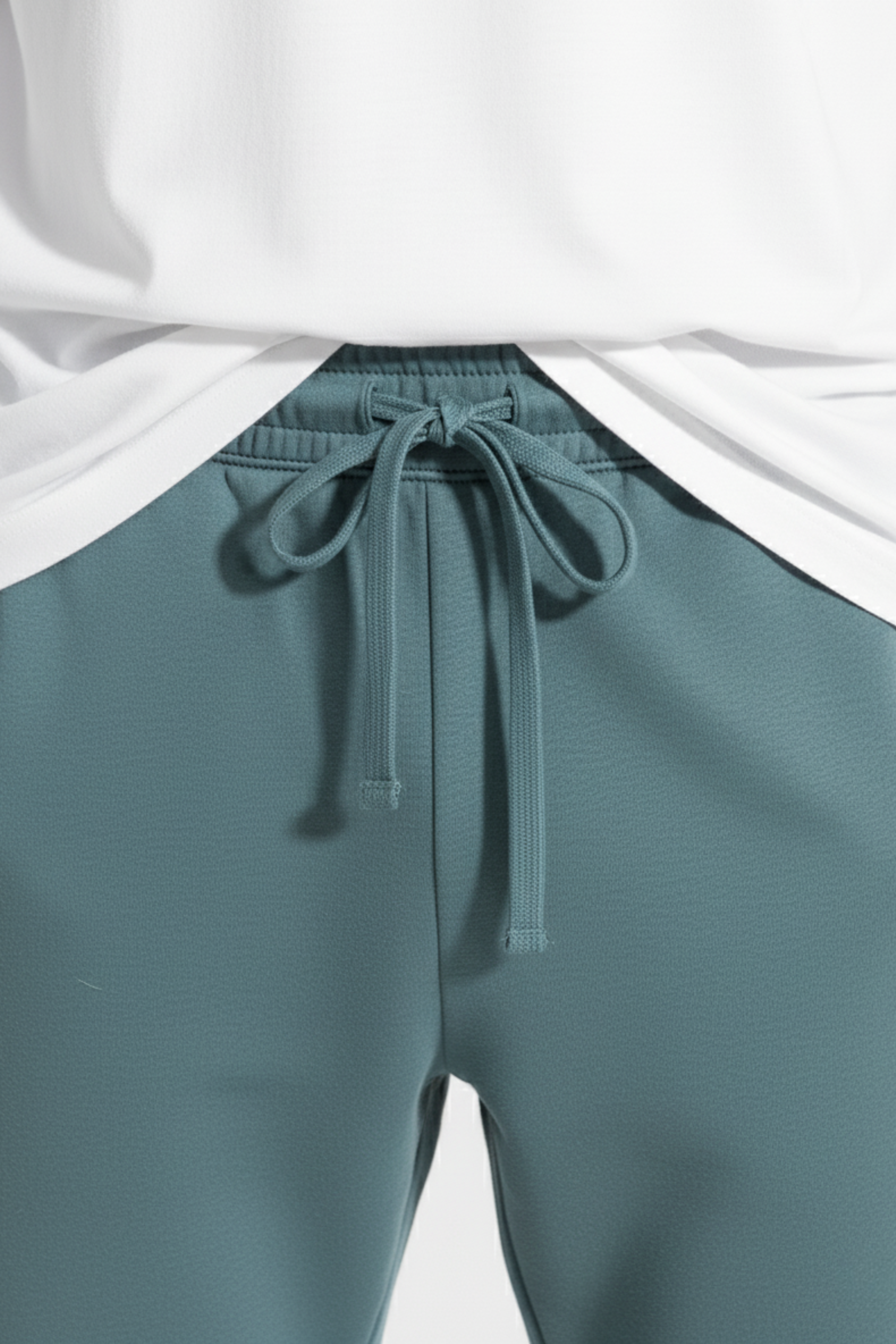 Teal men’s winter trousers close up showing adjustable drawstring waist