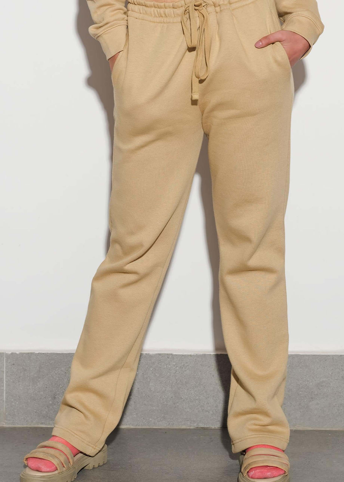 model wearing beige loose fit sweatpants for women at verve