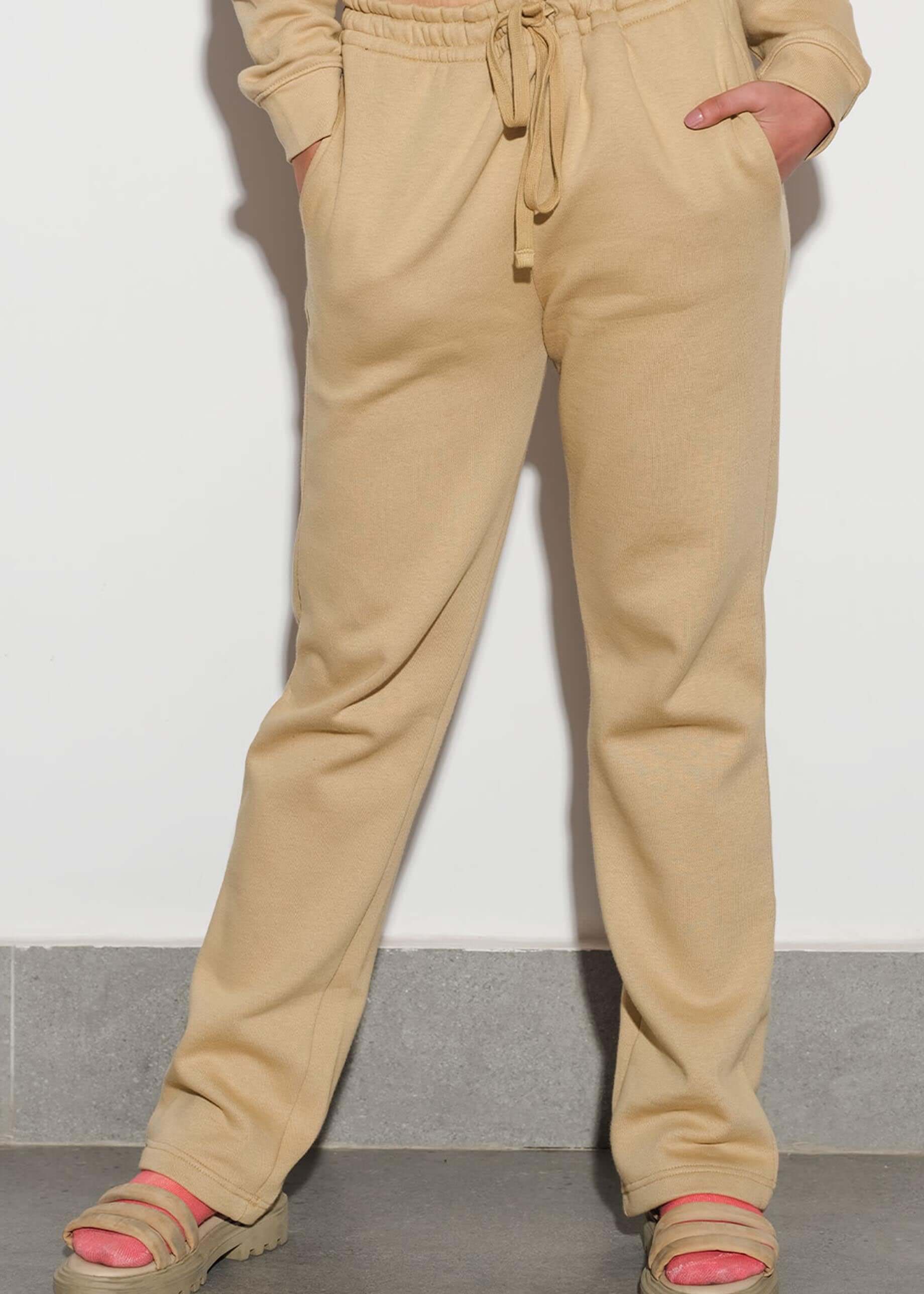 model wearing beige loose fit sweatpants for women at verve