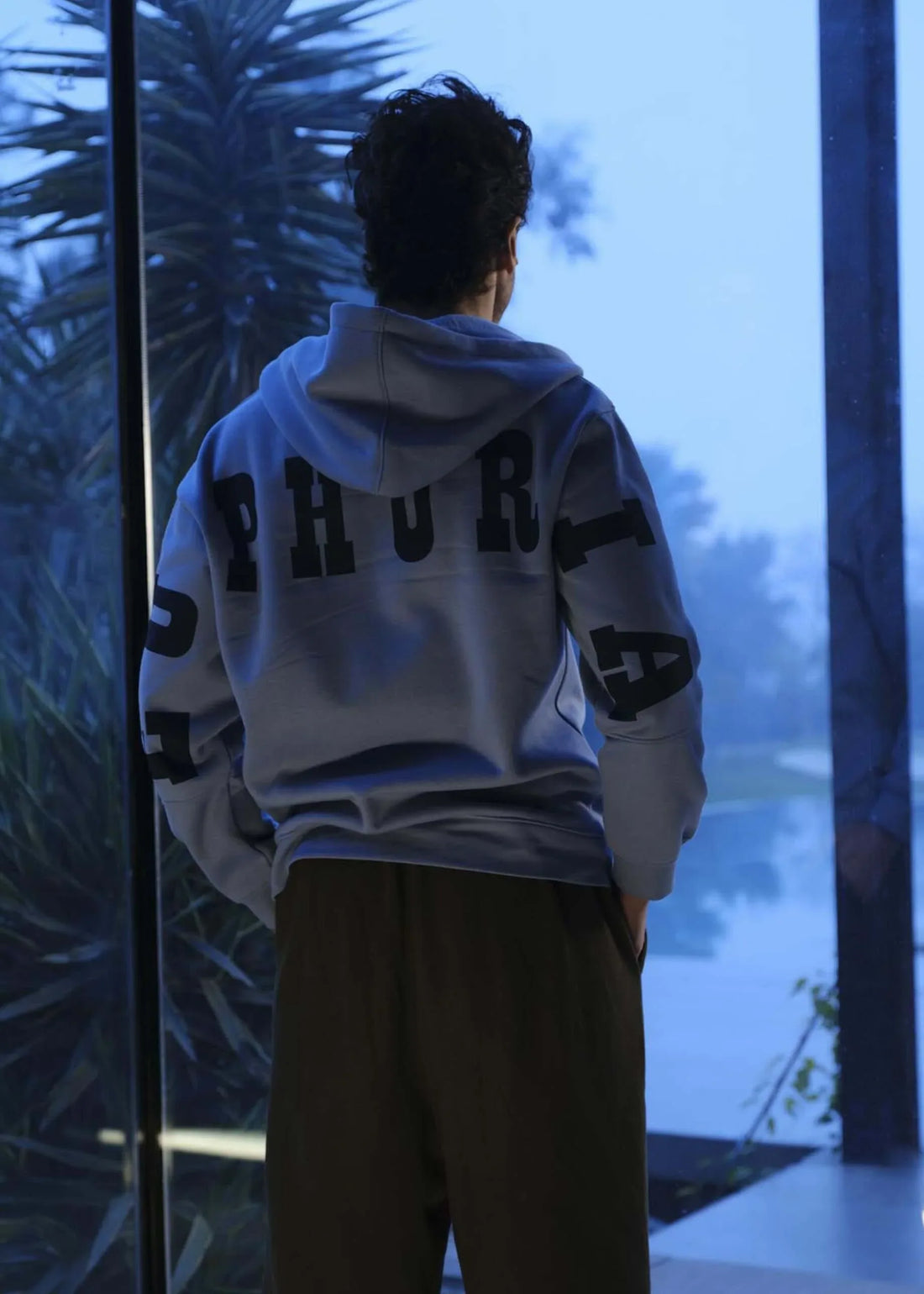 man wearing the drop shoulder hoodie euphoria by verve pakistan