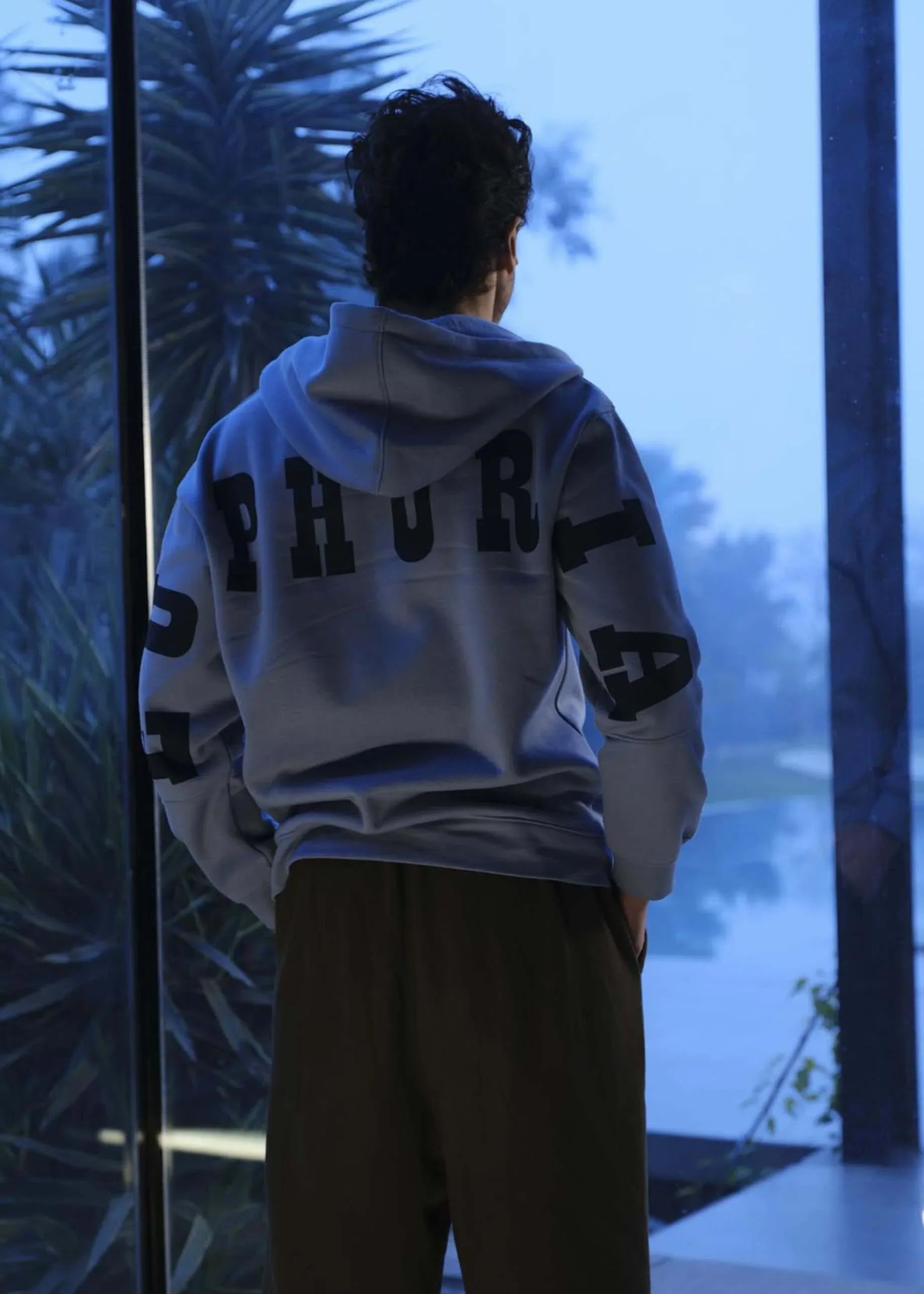 man wearing the drop shoulder hoodie euphoria by verve pakistan