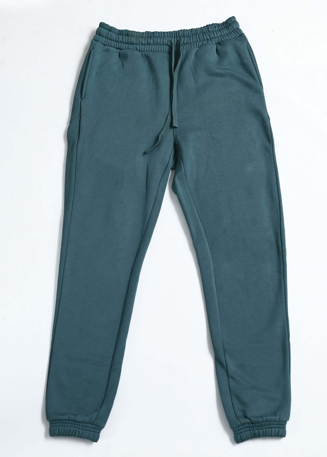 teal winter trousers for women flat lay