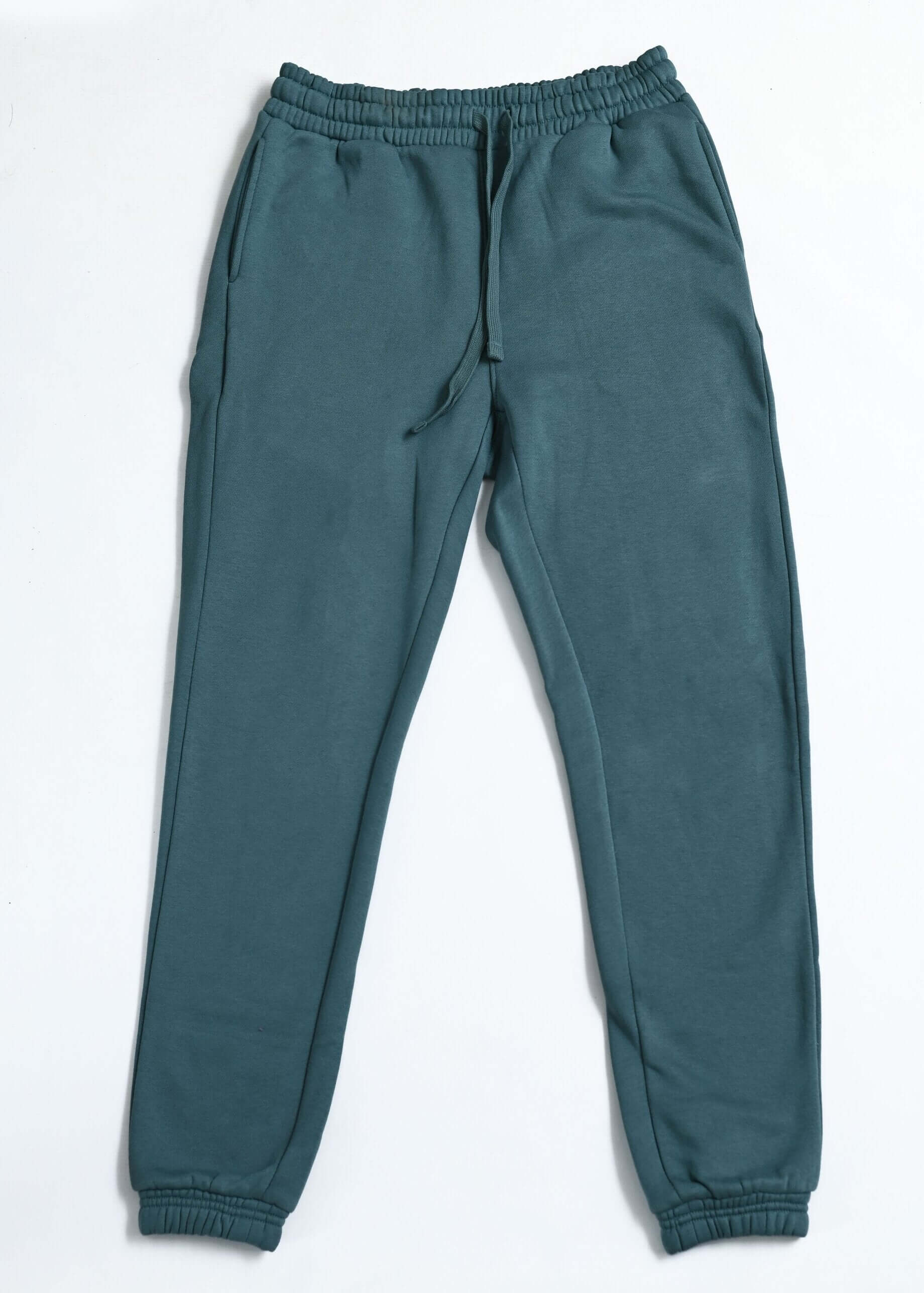 teal winter trousers for women flat lay