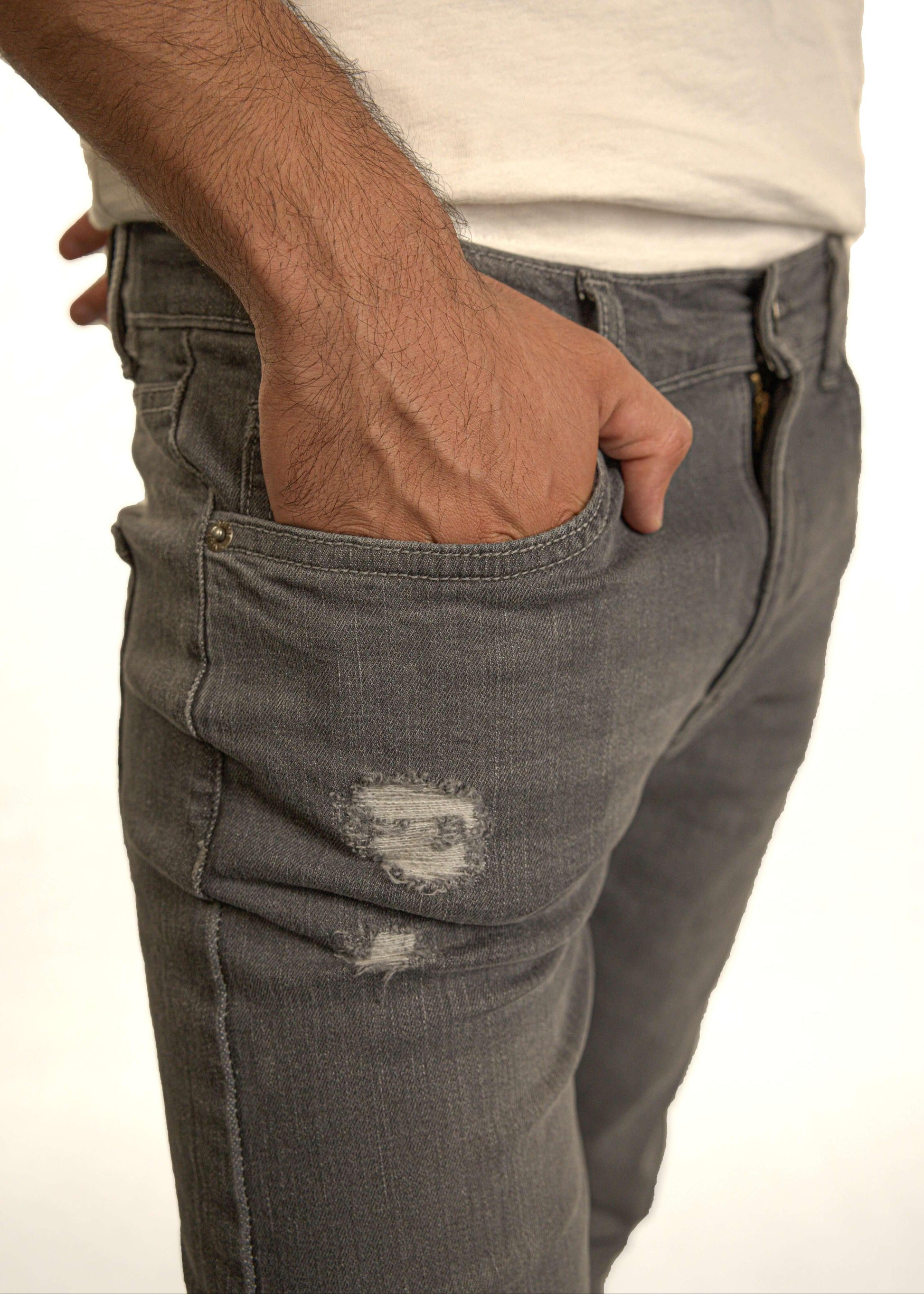Grey slim fit denim jeans for men close-up showing pocket and fabric detail
