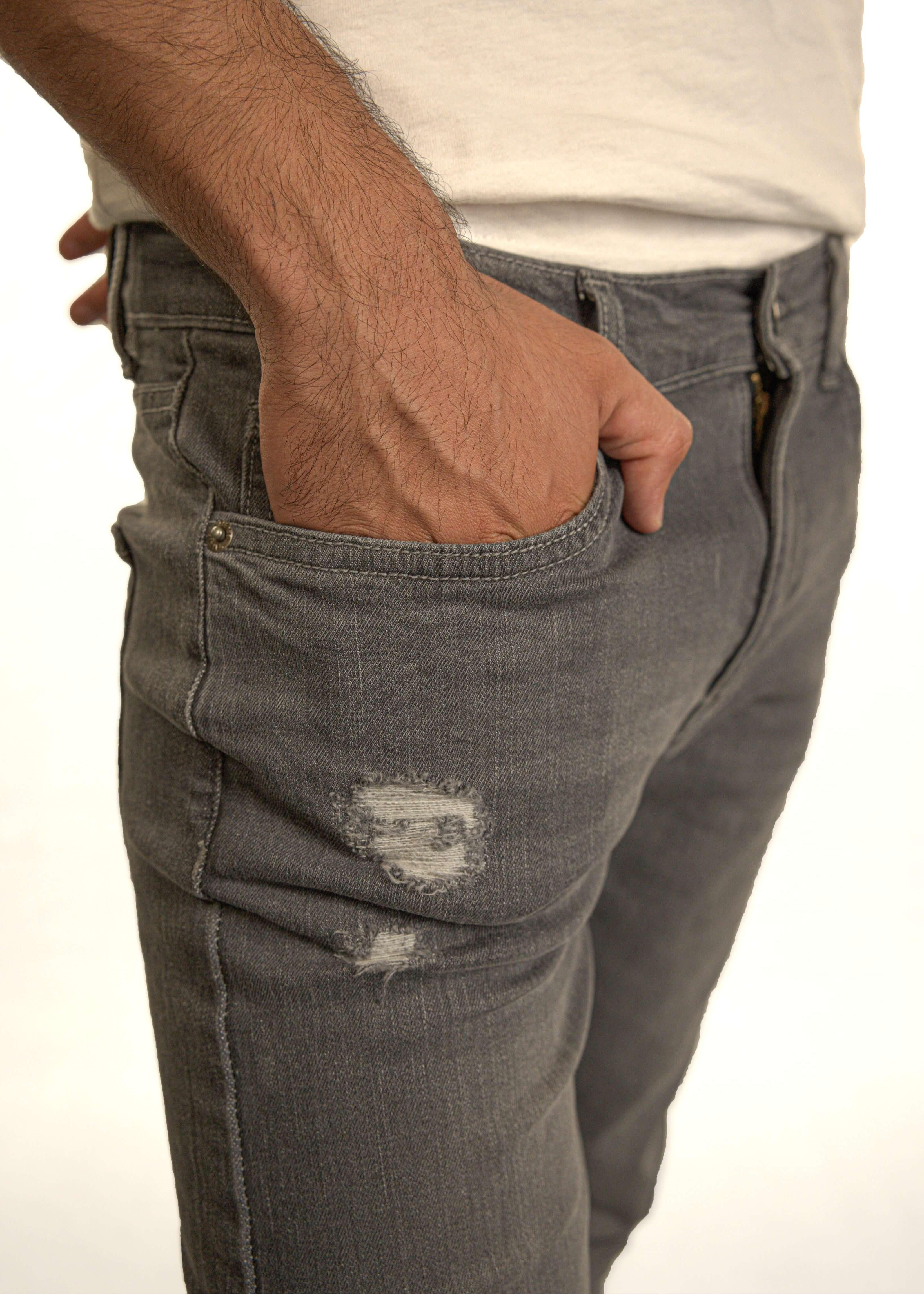 Grey slim fit denim jeans for men close-up showing pocket and fabric detail